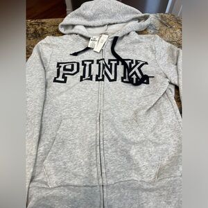 NWT Victoria secret- Pink zip up hoodie. Grey w black lettering. Size XS
